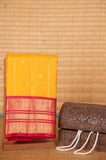Yellow and pink zari checked silk saree