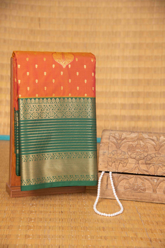 Golden orange and dark green semi silk saree