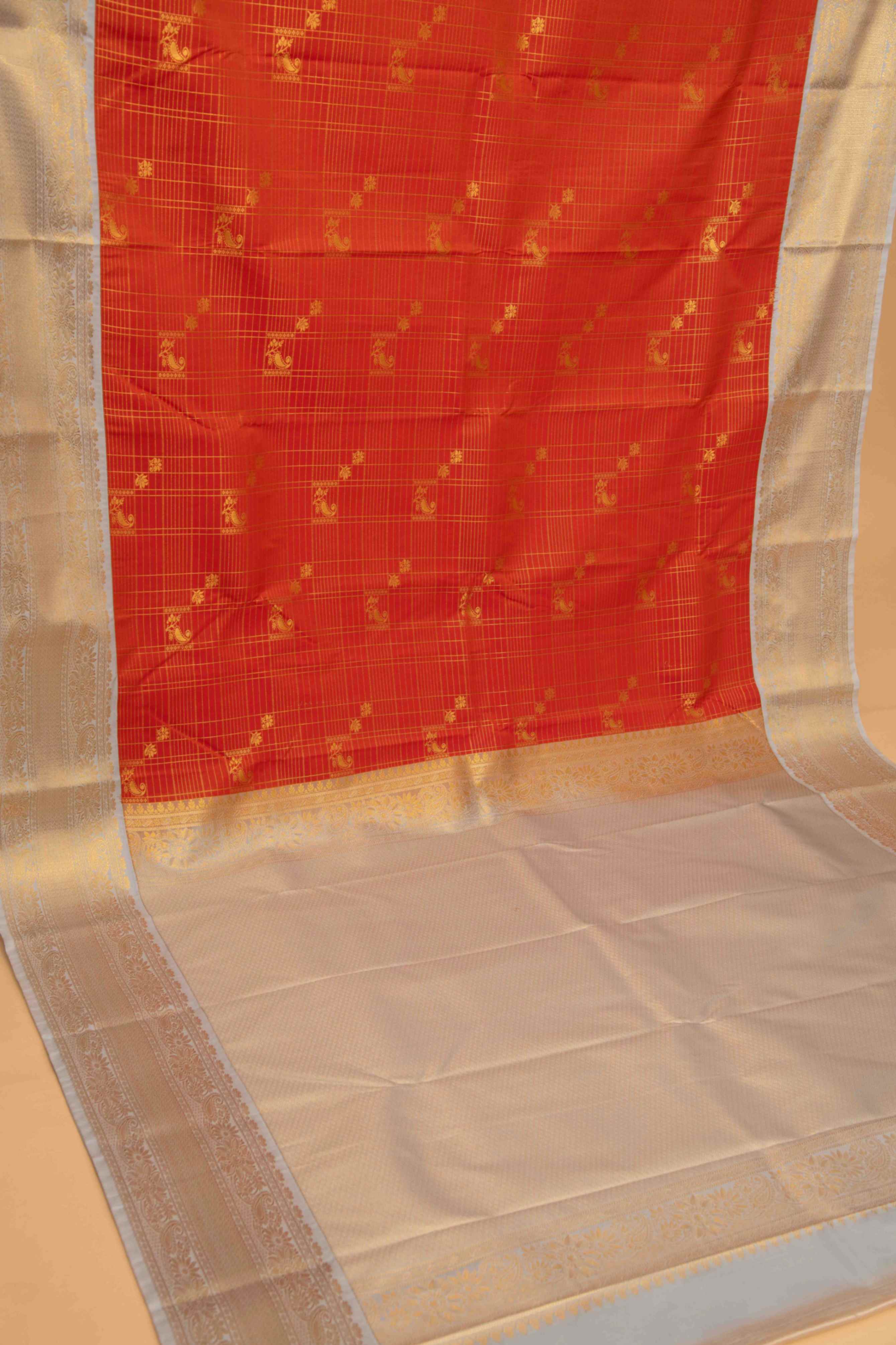 Tangerine orange and grey zari kattam semi silk saree
