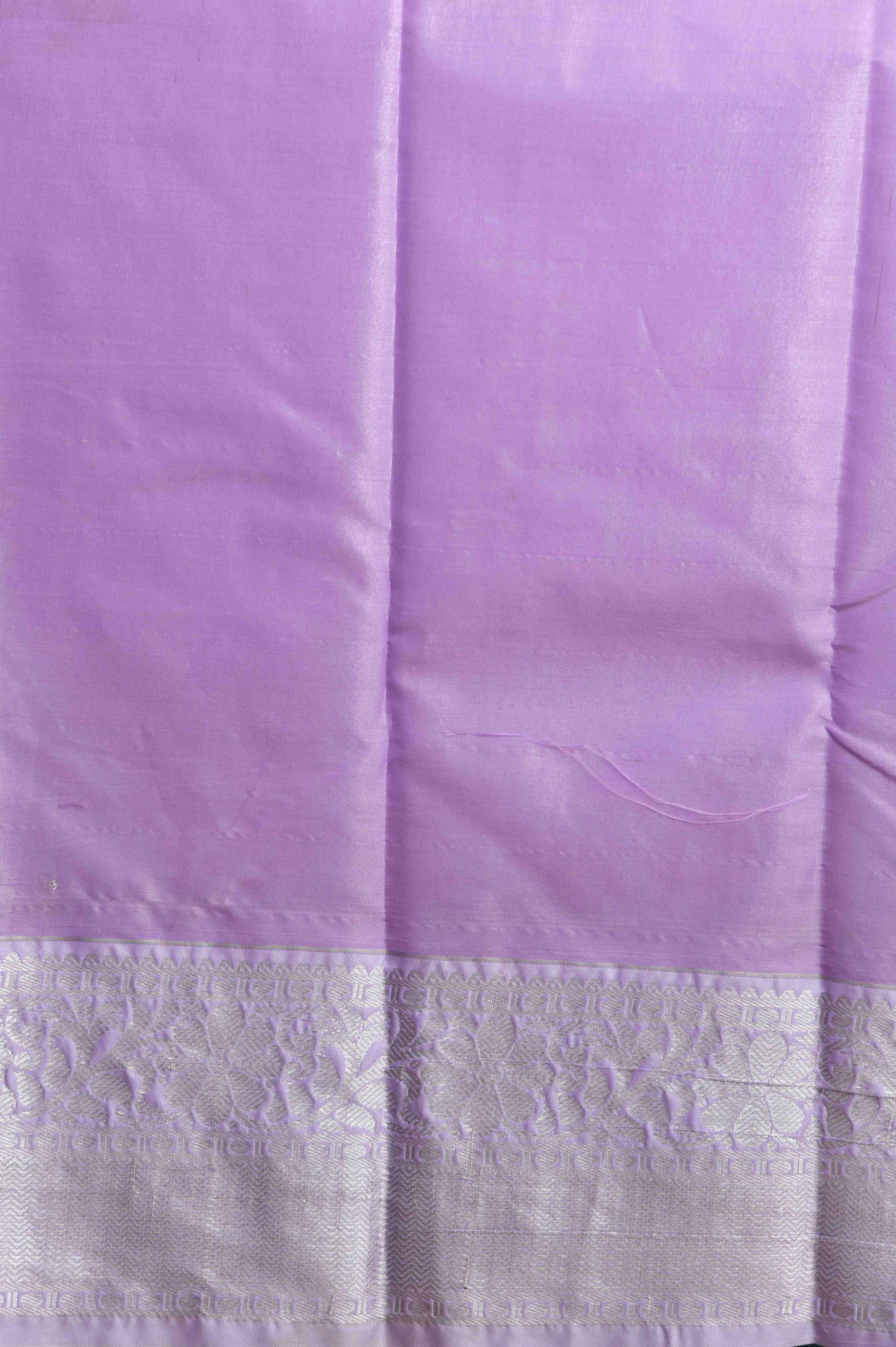 Pastel pink and lavender brocade semi silk saree